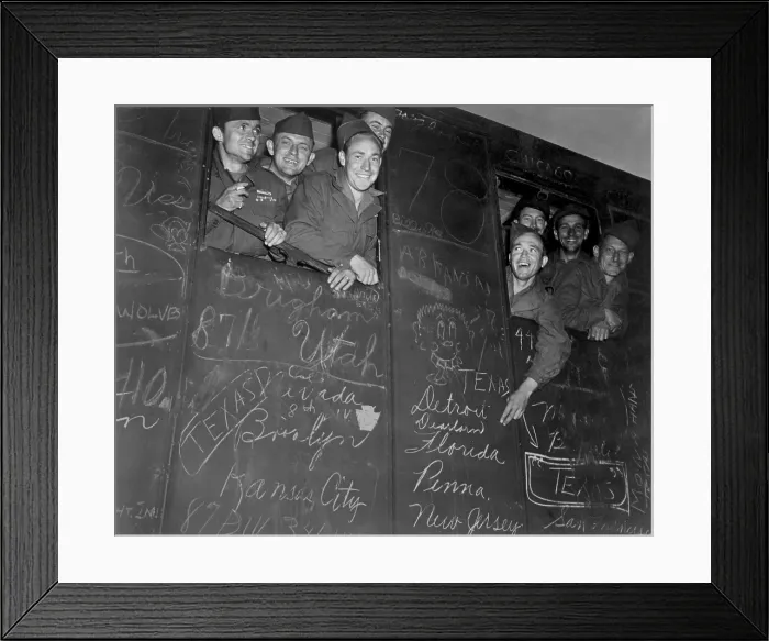 Framed Print : Happy Veterans, some of the first to be sent home under the Army's new point system. They are a board a train for Le Havre, France. May 25, 1945. World War 2