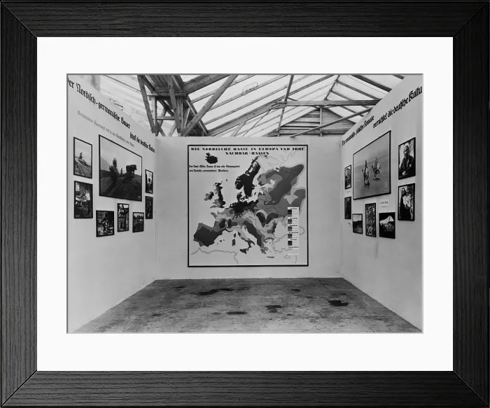Framed Print : Nazi anti-Semitic propaganda in a 1934 photo exhibit about various European races'. In center is a map identifying racial areas Framed Print : Nazi anti-Semitic propaganda in a 1934 photo exhibit about various European races'. In center is a map identifying racial areas