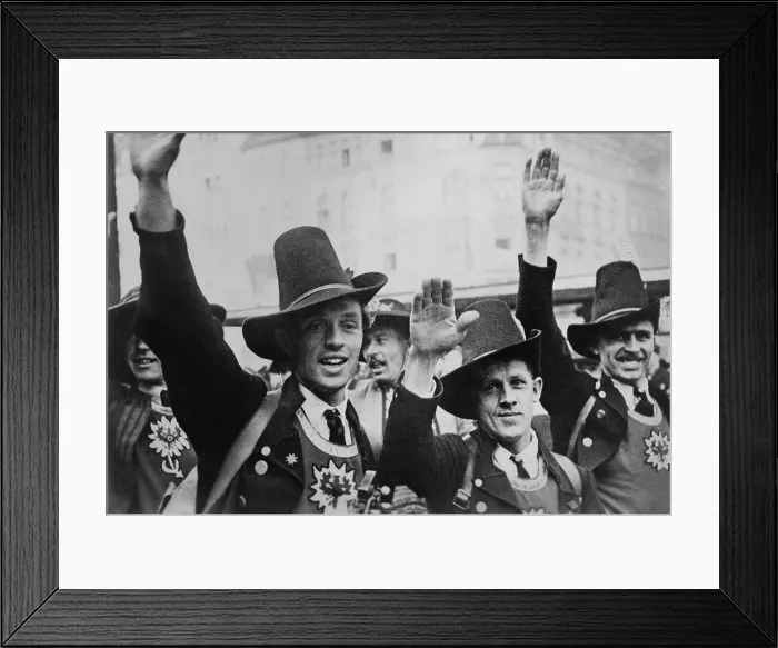 Framed Print : Men in Tyrolean costume celebrate the German annexation of Austria with a Nazi salute