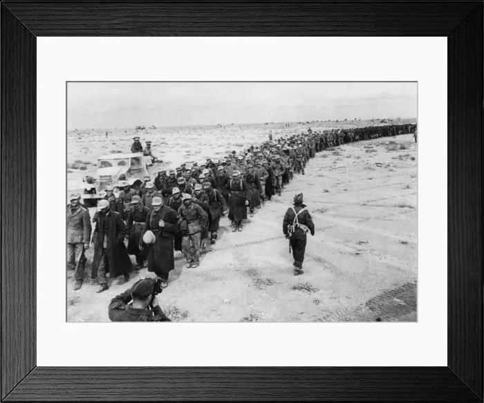 Framed Print : Long line of German prisoners captured during the Battle of Libya. They are marching from the battle front to a prisoners-of-war camp near Tobruk. Ca. 1942 during World War 2