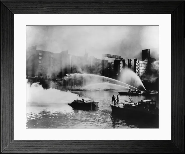 Framed Print : London Firemen direct water from their fireboats onto blazing warehouse. The Germans bombed the port facilities on the London waterfront Framed Print : London Firemen direct water from their fireboats onto blazing warehouse. The Germans bombed the port facilities on the London waterfront