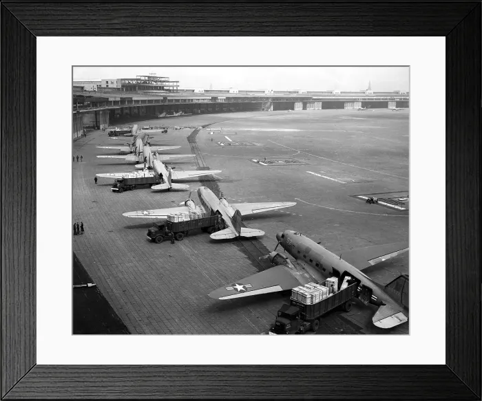 Framed Print : C-47s unloading at Tempelhof Airport during the Berlin Airlift, June-August 1948. In September 1948 they were replaced by larger and faster four-engine C-54s