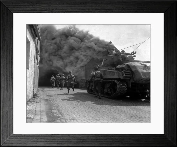 Framed Print : U.S. infantrymen running through the smoke-filled streets of Wernberg, Germany. 55th Armored Infantry Battalion and tank of the 22nd Tank Battalion. April 22, 1945. World War 2