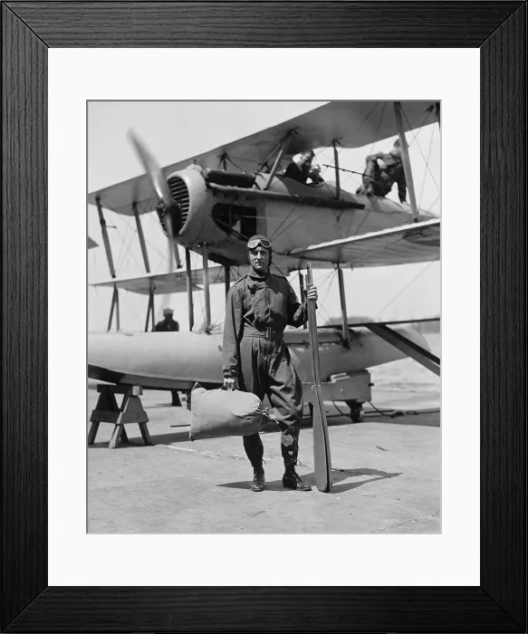 Framed Print : Admiral Richard Evelyn Byrd, carrying a satchel containing a rubber life boat, April 27, 1925