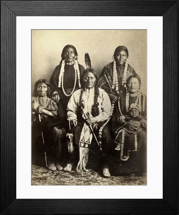Framed Print : Four generations of Sitting Bulls family at Fort Randall in 1882. The warrior chief sits with a sister, two wives, a daughter, her daughter, and her baby Framed Print : Four generations of Sitting Bulls family at Fort Randall in 1882. The warrior chief sits with a sister, two wives, a daughter, her daughter, and her baby