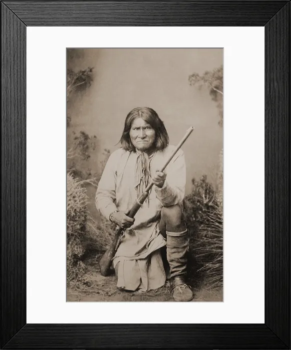 Framed Print : Geronimo, the great Chiricahua Apache war chief, kneeling with a rifle, 1887. Photograph by Ben Wittick