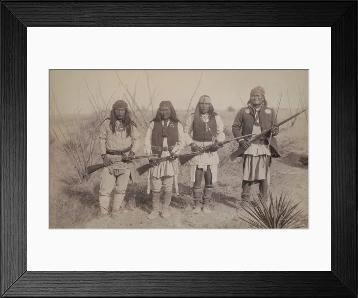 Framed Print : Geronimo, standing on the right, holding a long rifle, with a son and two warriors, each holding rifles. Photo by C. S