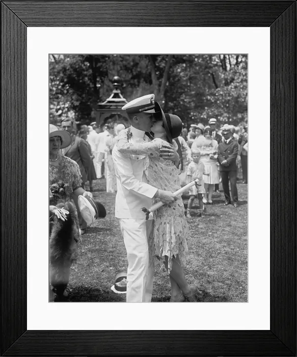 Framed Print : Navy Ensign Clyde Roberts kissing Ann Tardy after commencement exercises at Annapolis, Maryland