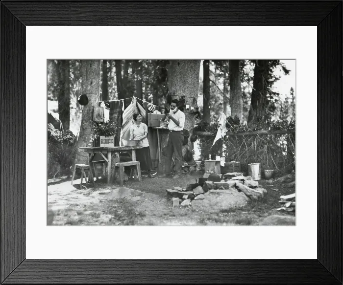Framed Print : Young couple camping at the Lake Basin Public Camp, Cleveland National Forest, California, 1922. The camp ground has a table with benches and a concrete fireplace