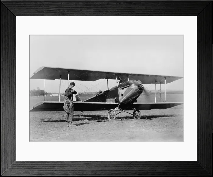 Framed Print : Charles Lindbergh, adjusting parachute before testing an experimental plane, c. 1925 Framed Print : Charles Lindbergh, adjusting parachute before testing an experimental plane, c. 1925