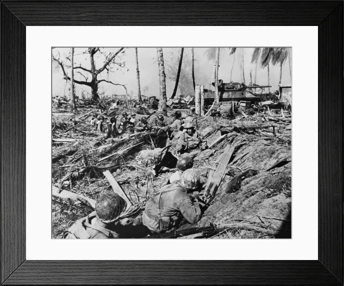 Framed Print : U.S. soldier halts its advance on while a tank blasts Japanese positions on Kwajalein Island. Jan. 31-Feb. 3, 1944. Marshall Islands, World War 2. (BSLOC_2014_10_104)