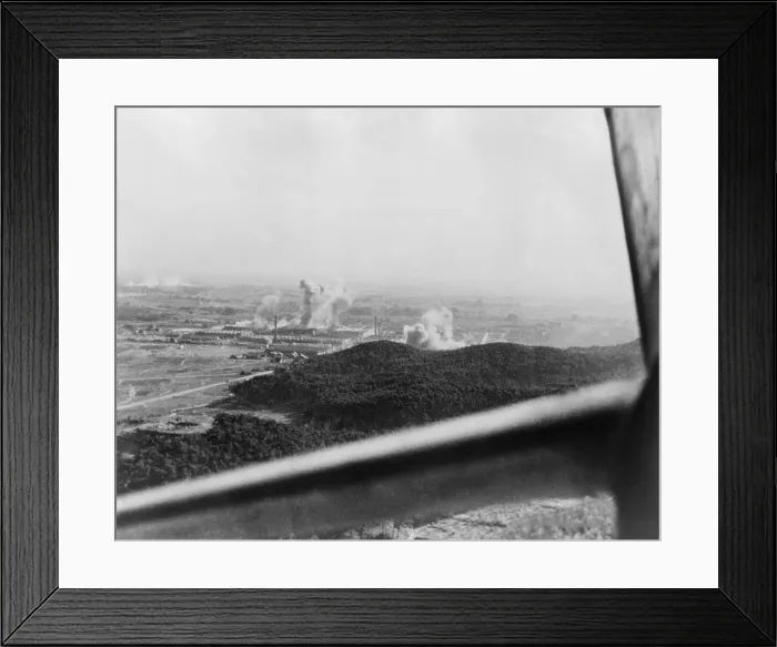 Framed Print : U.S. carrier-based planes bomb a factory plant near Tokyo in 1945. Framing the scene is the window of an American airplane. World War 2. (BSLOC_2014_10_118) Framed Print : U.S. carrier-based planes bomb a factory plant near Tokyo in 1945. Framing the scene is the window of an American airplane. World War 2. (BSLOC_2014_10_118)