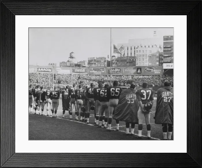 Framed Print : New York Giants football team during a moment of prayer for President John Kennedy. Nov. 24, 1963. The game was well attended, but not telecast