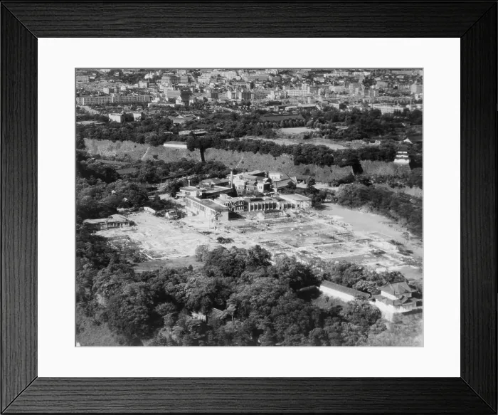 Framed Print : Aerial view of the Imperial Palace in Tokyo, after being bombed by U.S. airplanes. The damaged buildings are outside the walls of the major palace complex. 1945. World War 2