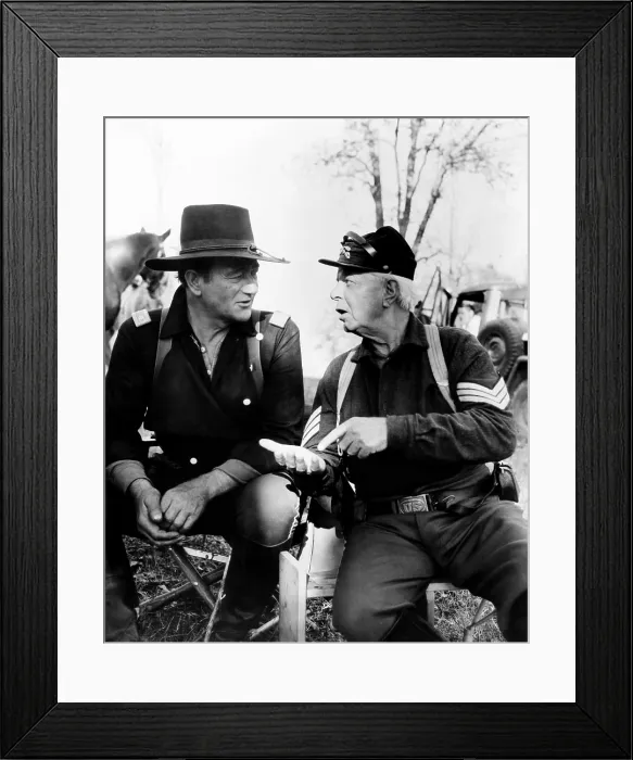 Framed Print : THE HORSE SOLDIERS, from left, John Wayne, Hoot Gibson, on-set, 1959 Framed Print : THE HORSE SOLDIERS, from left, John Wayne, Hoot Gibson, on-set, 1959