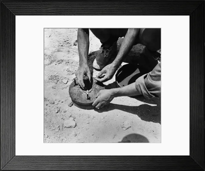 Framed Print : Two Italian soldiers disarming a land mine in the Axis occupied zone of Egypt. 1942. World War 2. (BSLOC_2014_10_160) Framed Print : Two Italian soldiers disarming a land mine in the Axis occupied zone of Egypt. 1942. World War 2. (BSLOC_2014_10_160)