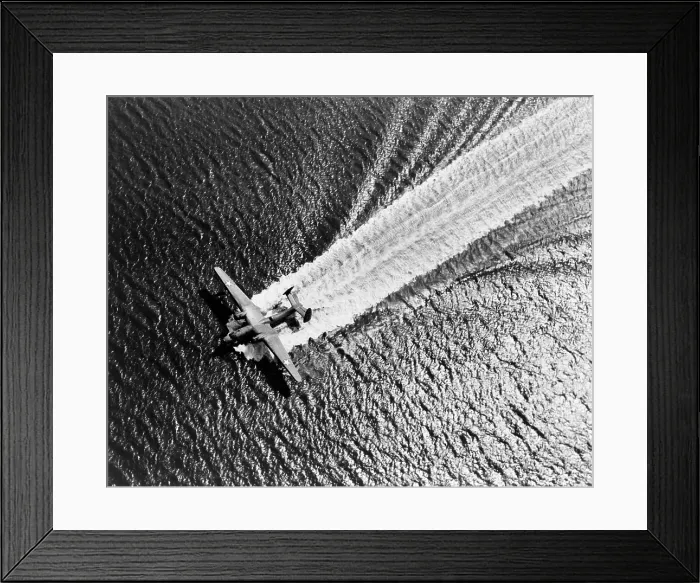 Framed Print : U.S. Navy Martin Mariner airplane landing on the water. The flying boat was fitted with five gun turrets, and bomb bays during World War 2. 1943. (BSLOC_2014_10_166)