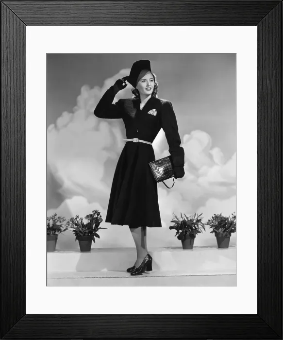 Framed Print : REMEMBER THE NIGHT, Barbara Stanwyck, in a dark green suit by Edith Head, with dark brown alligator bag and shoes, 1940 Framed Print : REMEMBER THE NIGHT, Barbara Stanwyck, in a dark green suit by Edith Head, with dark brown alligator bag and shoes, 1940