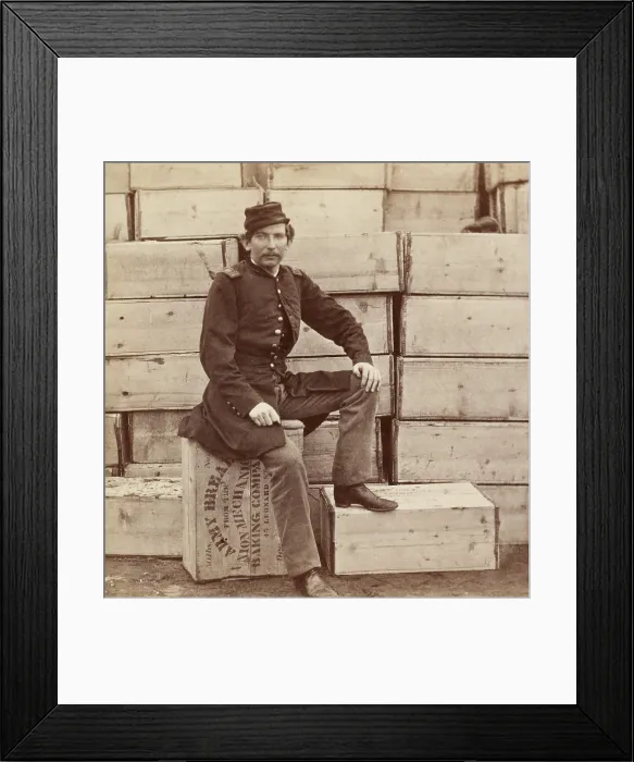 Framed Print : Union Captain J. W. Forsyth, the Provost Marshall, sits on a crate of hardtack, Aquia Creek, Virginia, Feb. 1963. The crate is labeled, 50 lbs. net