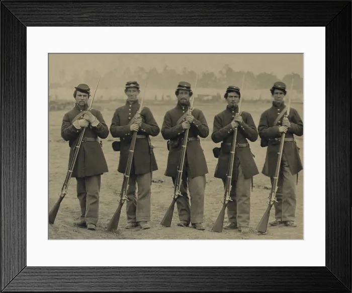 Framed Print : Five Union soldiers wear frock coat uniforms, as they stand at ease with their Enfield Rifles. An encampment is visible in the background