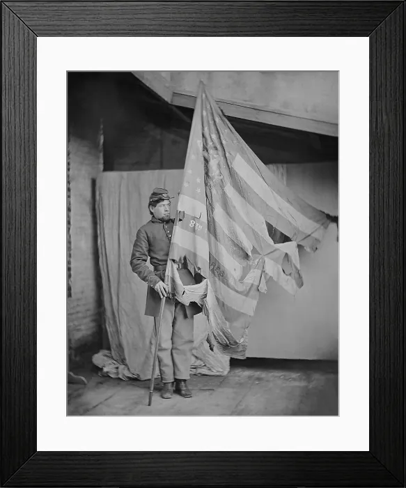 Framed Print : Studio portrait of a Union soldier with the tattered battle flag of the 8th Pennsylvania Volunteers