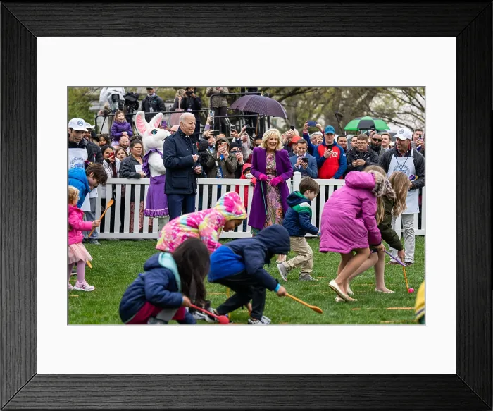 Framed Print : President Joe Biden and First Lady Jill Biden enjoy watching children compete in the White House Easter Egg Roll, April 18, 2022. (BSLOC_2022_3_37) Framed Print : President Joe Biden and First Lady Jill Biden enjoy watching children compete in the White House Easter Egg Roll, April 18, 2022. (BSLOC_2022_3_37)