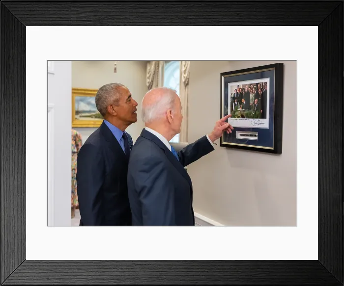 Framed Print : President Joe Biden and former President Barack Obama reminisce by a framed photo of President Obama signing the Affordable Care Act, on March 23, 2010 Framed Print : President Joe Biden and former President Barack Obama reminisce by a framed photo of President Obama signing the Affordable Care Act, on March 23, 2010
