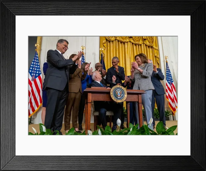 Framed Print : President Joe Biden hands a commemorative pen to former President Barack Obama after signing his second executive order to strengthen the Affordable Care Act, April 5, 2022