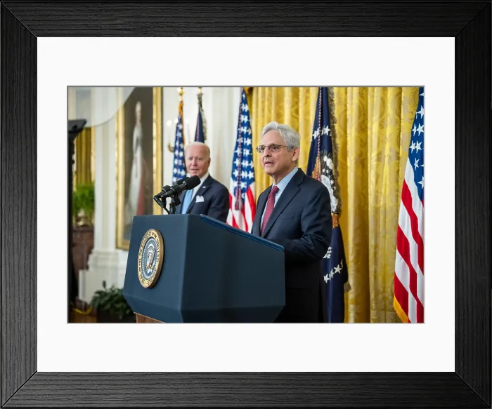 Framed Print : Attorney General Merrick Garland speaks during a Medal of Valor ceremony, as President Biden looks on, May 16, 2022