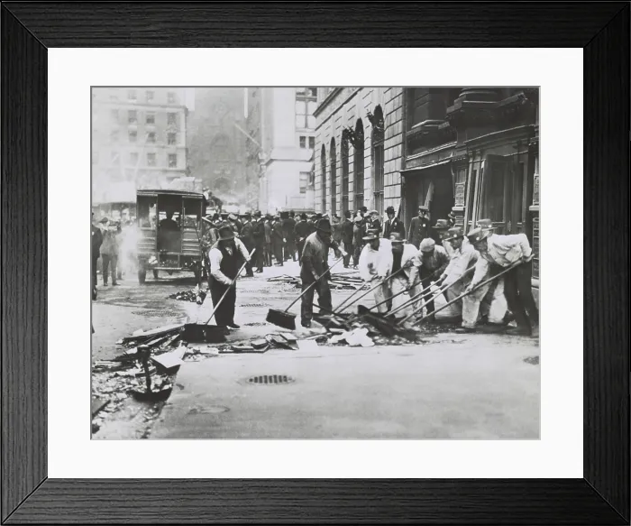 Framed Print : Workers sweeping up rubble and broken glass following Wall St. Bombing of Sept. 16, 1920