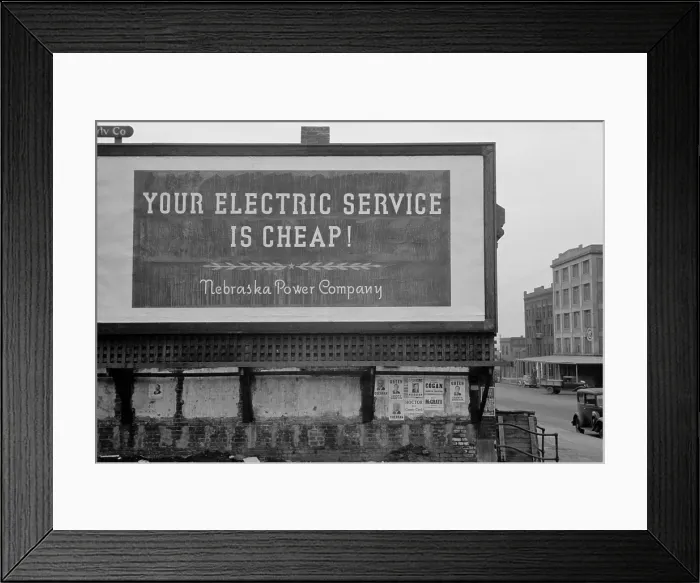 Framed Print : Your Electric Service is Cheap reads a 1930s billboard. Posted by the Nebraska Power Company. (BSLOC_2013_7_107)