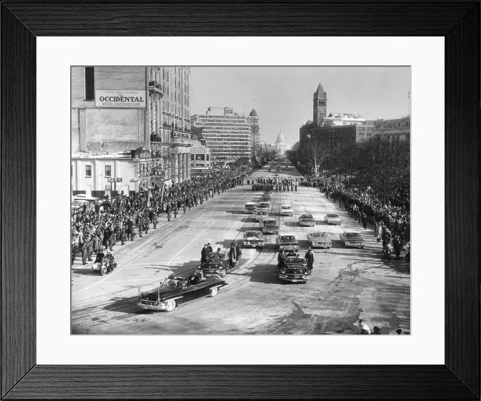 Framed Print : President John Kennedy and First Lady Jacqueline Kennedy in lead car of the Inaugural Parade. The parade stretches up Pennsylvania Avenue to the distant Capitol. Jan. 20, 1961