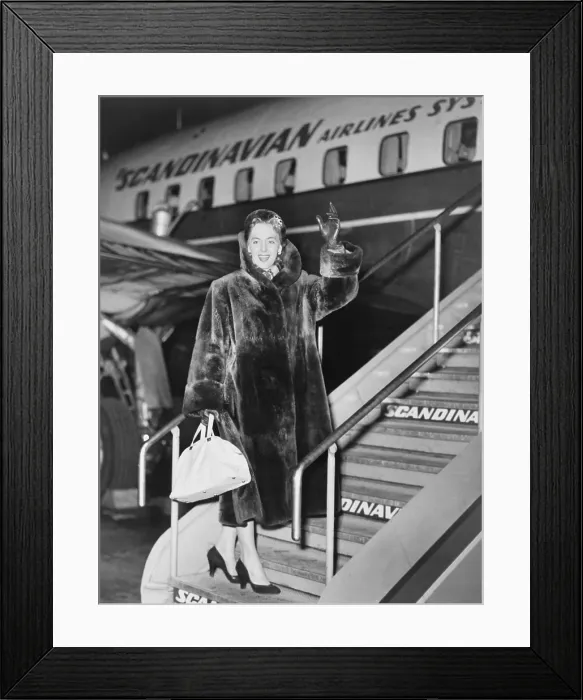 Framed Print : Christine Jorgensen, waves as she boards an airplane, at Copenhagen, Denmark, in Feb. 1953 Framed Print : Christine Jorgensen, waves as she boards an airplane, at Copenhagen, Denmark, in Feb. 1953