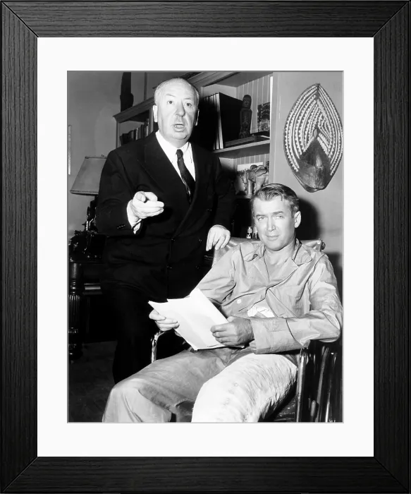 Framed Print : REAR WINDOW, from left: director Alfred Hitchcock, James Stewart on set, 1954