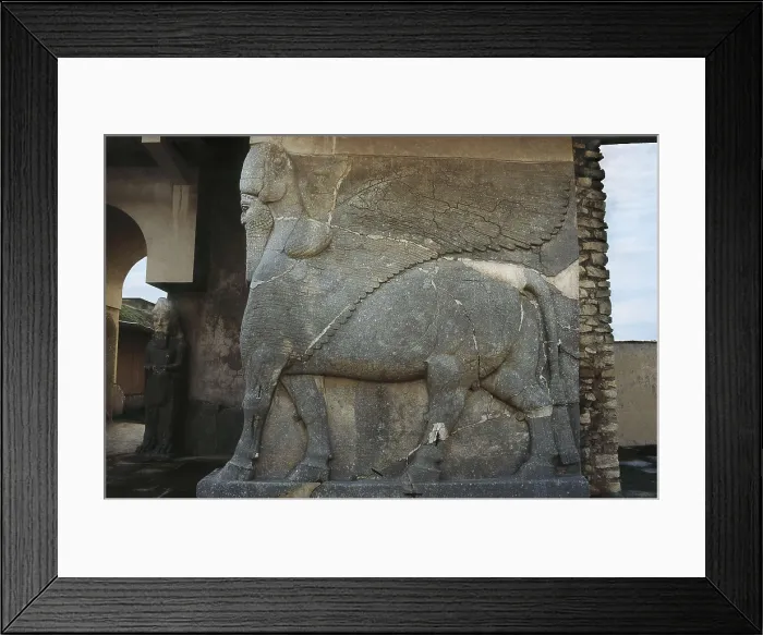 Framed Print : IRAQ. Kalhu. Nimrud. Ashur Palace (12th c. BC). Winged bull with human head. Relief. Assyrian art. Sculpture on rock. AISA / Everett Collection**US SALES ONLY**