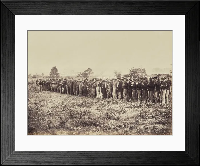 Framed Print : Confederate Prisoners, captured at the Battle of Fairfax Court-House, June 27, 1863. There are uniformed Union guards on both sides of the formation