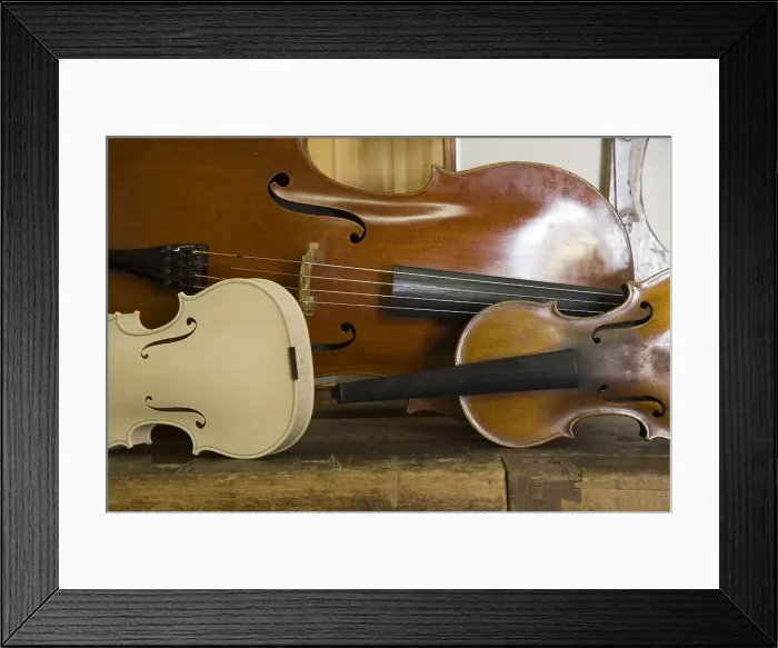 Framed Print : ITALY. Cremona. Luthier's workshop. String instruments: cello and violin. AISA / Everett Collection**US SALES ONLY**