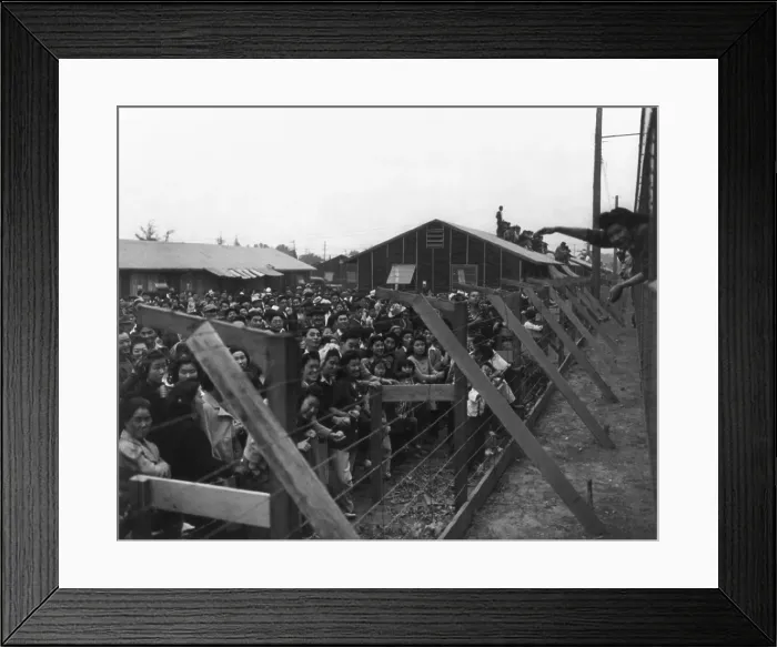 Framed Print : Japanese Americans behind barbed wire fence waving to friends leaving Santa Anita Camp on a train