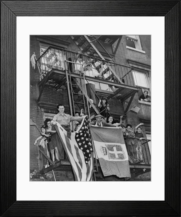 Framed Print : Italian Americans celebrating the armistice between Italy and the Allies. They wave American and Italian flags from their balconies in New York City. Sept. 8, 1943. World War 2