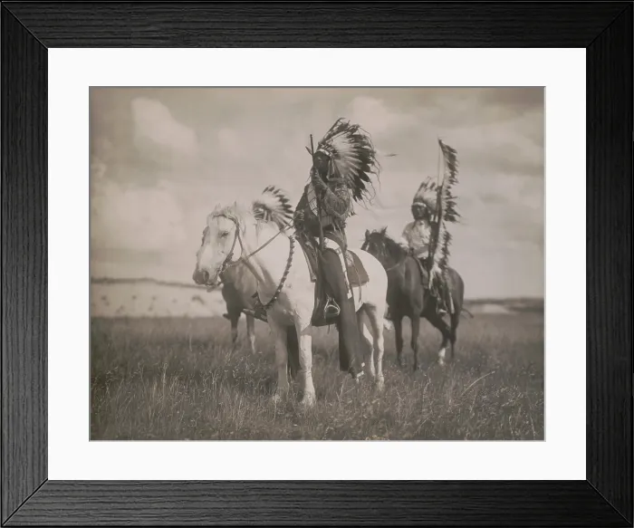 Framed Print : SIOUX CHIEFS, 1905, photograph by Edward Curtis. The photo depicts three Native Americans, on horseback, wearing feather headdresses (BSLOC_2019_9_20)
