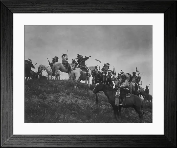 Framed Print : PLANNING A RAID, 1907, photograph by Edward Curtis. The photo depicts ten Native Americans, wearing feather headdresses on horseback on a hill (BSLOC_2019_9_21) Framed Print : PLANNING A RAID, 1907, photograph by Edward Curtis. The photo depicts ten Native Americans, wearing feather headdresses on horseback on a hill (BSLOC_2019_9_21)