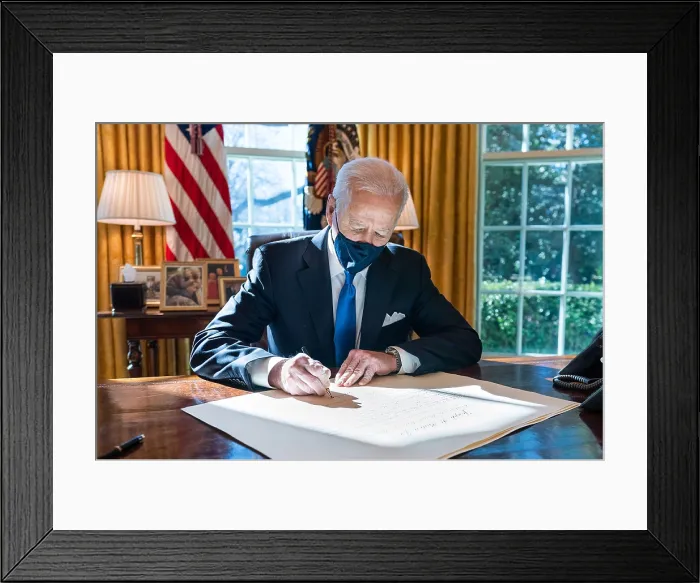 Framed Print : President Joe Biden, masked during the Covid-19 pandemic, signs a commission for Gina Raimondo as Secretary of Commerce, March 3, 2021 (BSLOC_2021_8_5)