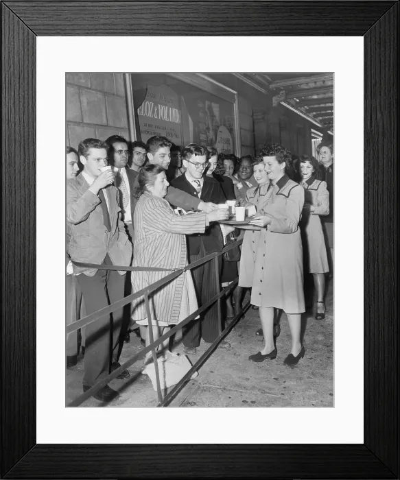 Framed Print : Roxy Theater usherettes dispense coffee and doughnuts to movie patrons at the premiere of Forever Amber'. New York City, 1947. - (BSLOC_2014_17_127)