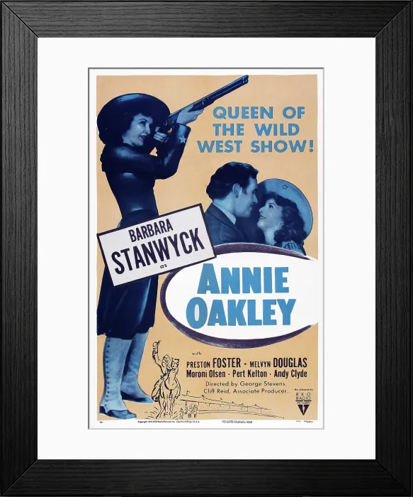 Framed Print : ANNIE OAKLEY, poster art, left and right: Barbara Stanwyck, center: Preston Foster, 1935 Framed Print : ANNIE OAKLEY, poster art, left and right: Barbara Stanwyck, center: Preston Foster, 1935