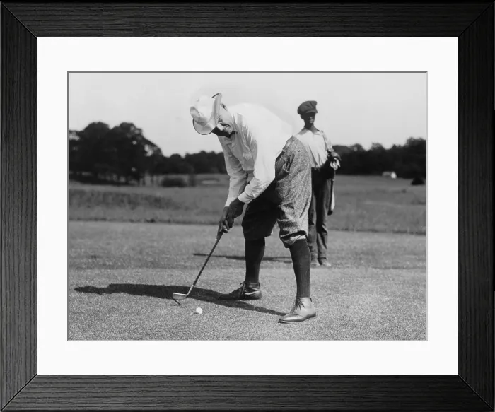 Framed Print : Warren G. Harding bending over to hit a golf ball, ca. 1921-23. Harding was not a great golfer, and struggled to break 95 (BSLOC_2020_2_136) Framed Print : Warren G. Harding bending over to hit a golf ball, ca. 1921-23. Harding was not a great golfer, and struggled to break 95 (BSLOC_2020_2_136)