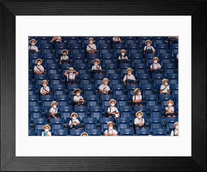 Framed Print : Japanese school children in stadium seats are socially distanced during the Covid-19 pandemic, Aug. 25, 2021