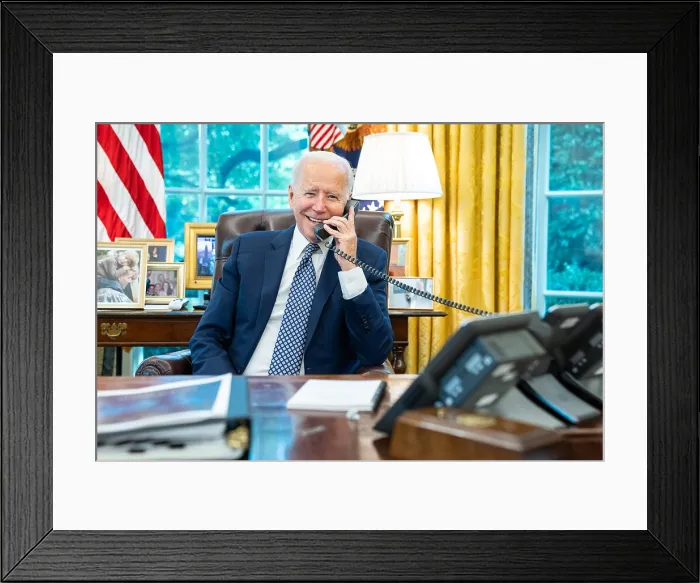Framed Print : President Joe Biden talks on the phone with House Speaker Nancy Pelosi, Aug. 24, 2021