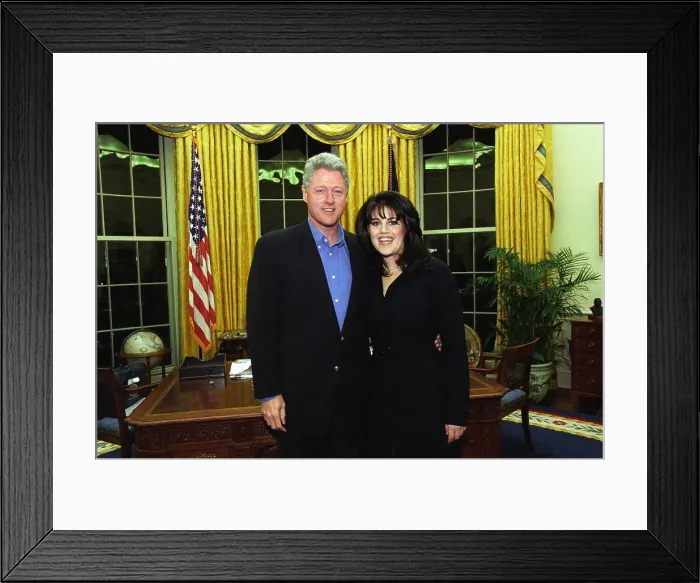 Framed Print : Monica Lewinsky poses with President Bill Clinton in the White House Oval Office. The photo is was taken on February 27, 1997, when she was a guest at his weekly radio address Framed Print : Monica Lewinsky poses with President Bill Clinton in the White House Oval Office. The photo is was taken on February 27, 1997, when she was a guest at his weekly radio address