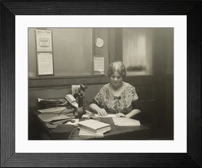 Framed Print : Robert La Follettes widow, Belle Case La Follette, works at THE PROGRESSIVE, her husbands political magazine, on Oct. 13, 1925. The Senator died four months earlier