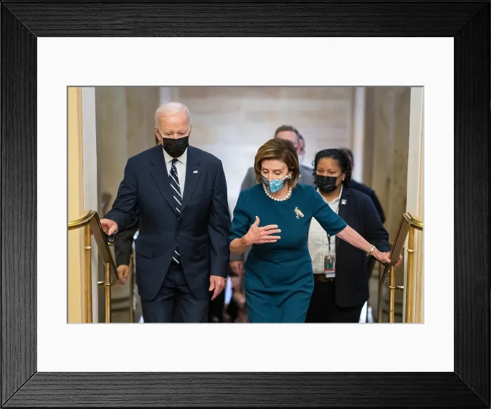 Framed Print : President Joe Biden walks with House Speaker Nancy Pelosi, as he departs the US Capitol after addressing the House Democratic Caucus, Oct. 28, 2021
